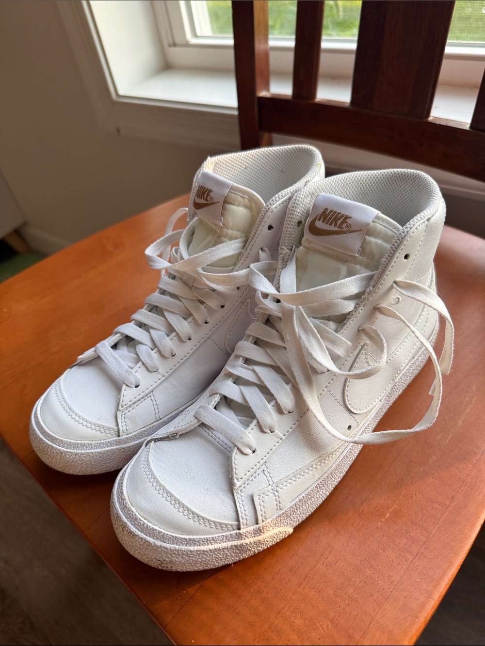 Nike Women’s White High-Top Sneakers with Gold Logo